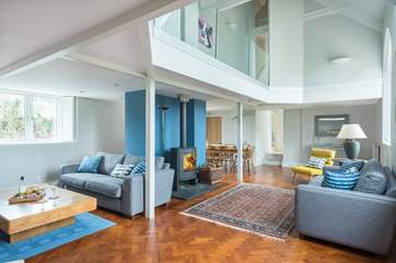 This area of the sitting/dining-room is open to the vaulted ceiling.