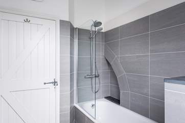 There is a fitted shower over the bath in the family bathroom.