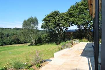 Looking from the side of the sunroom along the terrace at thr front.