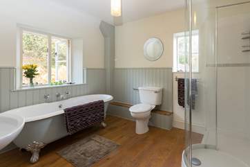 This is one of the wonderful family bathrooms. This one has a roll-top bath and a separate shower cubicle, with lovely polished wooden floor.