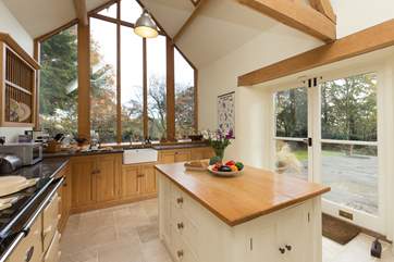 The island, the double Aga, the sink with a view... what a kitchen! Two sets of French windows lead to the terrace as well.