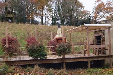 This is the outside cooking-area, a lovely al fresco deck with a built in barbecue and pizza oven.