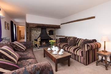 This sitting room has an the original inglenook fireplace - the wood burning stove is ornamental but you can light the two other wood burners in this wonderful house.