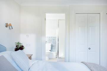 This lovely light bedroom to the front of the cottage has an en suite shower-room.