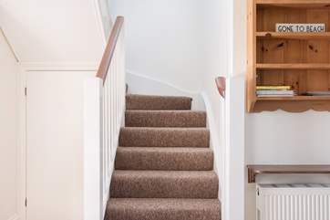Stairs lead up to the sitting-room, two bedrooms and the bathroom.