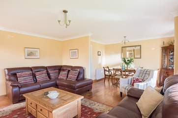 The open plan living and dining space leads through to the kitchen.