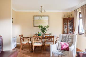 The dining area is to one side of this stylish living-room.