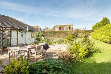 This pretty garden is well maintained with space for relaxing and space to play!