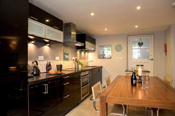 Serving up meals will be a doddle with the dining-table so easily accessible from the kitchen-area.
