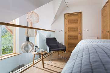 The master bedroom with mezzanine, with a full length blind to pull down at night.
