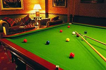 There is a full size table in the games room.