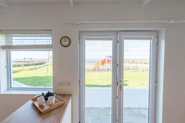 The kitchen/diner has sea views and over looks the village play area.