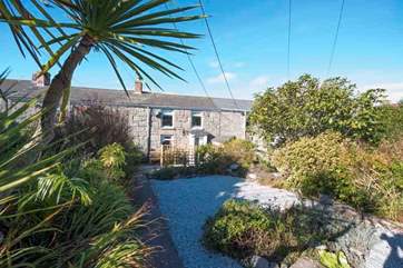 Honeysuckle Cottage is set back with a spacious gravelled front terrace.