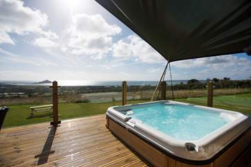 It even has its very own hot tub also enjoying the views.