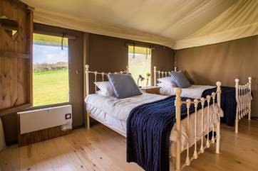 The twin beds in Bedroom 2.