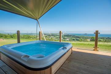 To top it off, you even have your own hot tub on the deck enjoying the panoramic views too.