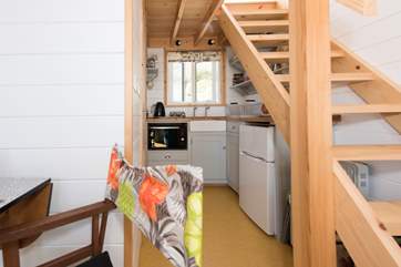 Stairs lead up to the sleeping area.