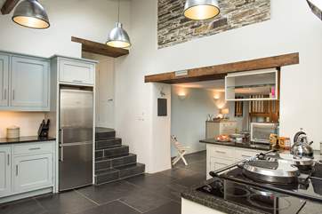 Steps lead up to the utility-area and cloakroom.