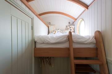 The cosy double bed with its beautiful view is accessed by a ladder (please take care).