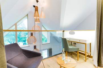 The Master bedroom has views down onto the living room below.