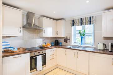 The kitchen is located to the front of the cottage.