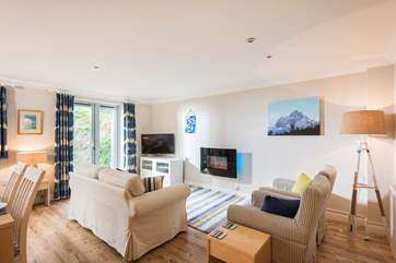 The open plan living-room is light, spacious and a super space for relaxing with friends and family.