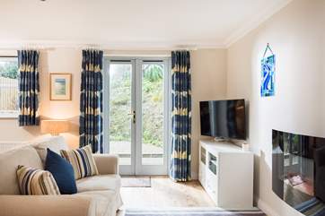 French doors lead out onto the enclosed patio garden (photos to follow).