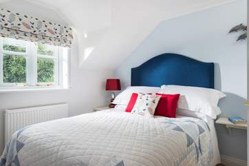 Bedroom 2 is at the rear of the cottage and is furnished with a double bed.