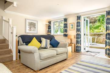 The cottage is spacious inside and has an enclosed patio garden to the rear.