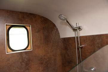 There is, of course, a proper shower and flushing loo.