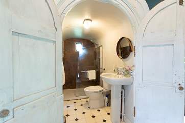 This unique shower room is behind the bedrooms.