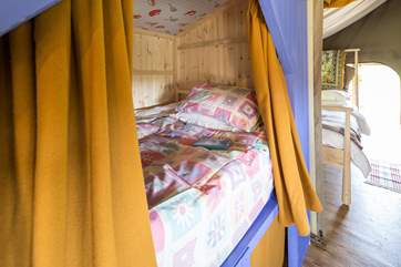 The cabin bed is a little den, where you can read by torchlight under the bedclothes and maybe even have a midnight feast!