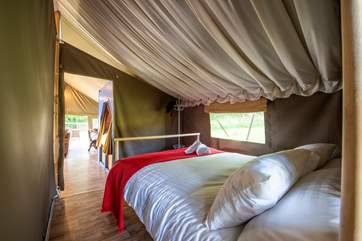 The bedrooms are reached through the living area.