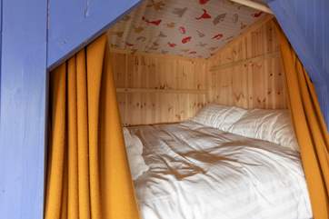 Children will love being in this cabin bed with the curtains drawn.