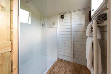 The shower-room has a glass screen and a heated towel rail for warm fluffy towels.
