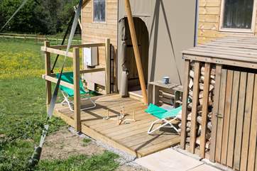 The sunny deck at the back of the tent is a great place to play, or snatch an hour of peace and quiet.