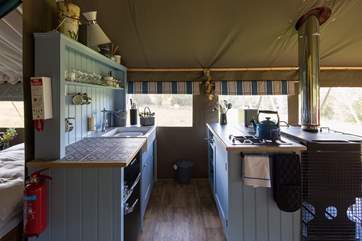 The kitchen is fully equipped with a Smeg gas hob and fridge freezer for holiday goodies.