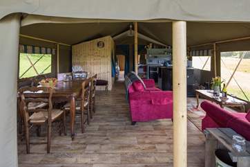 The open plan interior with dining/cooking/living space has views out over the countryside that surrounds it.