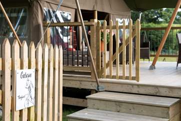 Gascon on the gate, identifies your holiday safari tent and gives a French welcome.