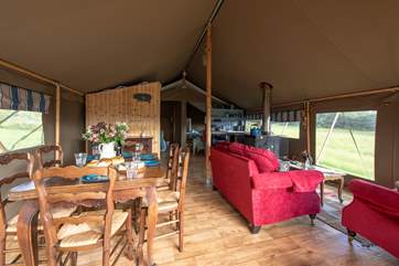 The open plan interior with dining/cooking/living space has views out over the countryside that surrounds it.