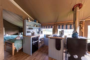 The kitchen is fully equipped with a Smeg gas hob and fridge freezer for holiday goodies.