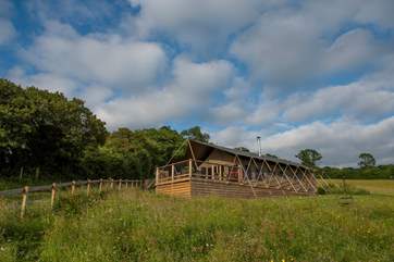 Gascon is the lower of the two safari tents, with great views over the Blackmore Vale from the decking.