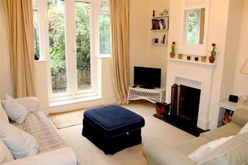 Living room with doors to the pretty garden.