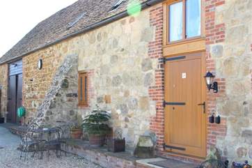 Through the large stable door you will find a door to each of the two properties in the barn.