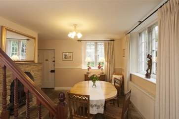 The dining-room is spacious and has a wood burner.
