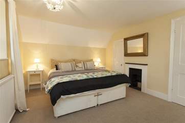 Even though there is a king-size bed in this bedroom there is still plenty of space.
