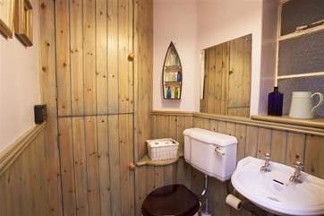 The downstairs cloakroom has a nautical feel.
