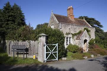 The lodge house is at the entrance to the Barton Manor Estate.