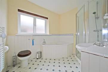Bathroom with corner bath.