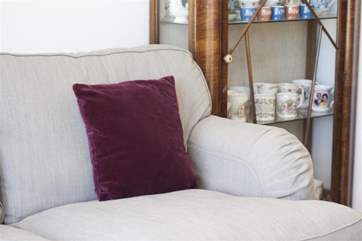 Comfortable soft furnishings and antique decor give this holiday home a special charm.